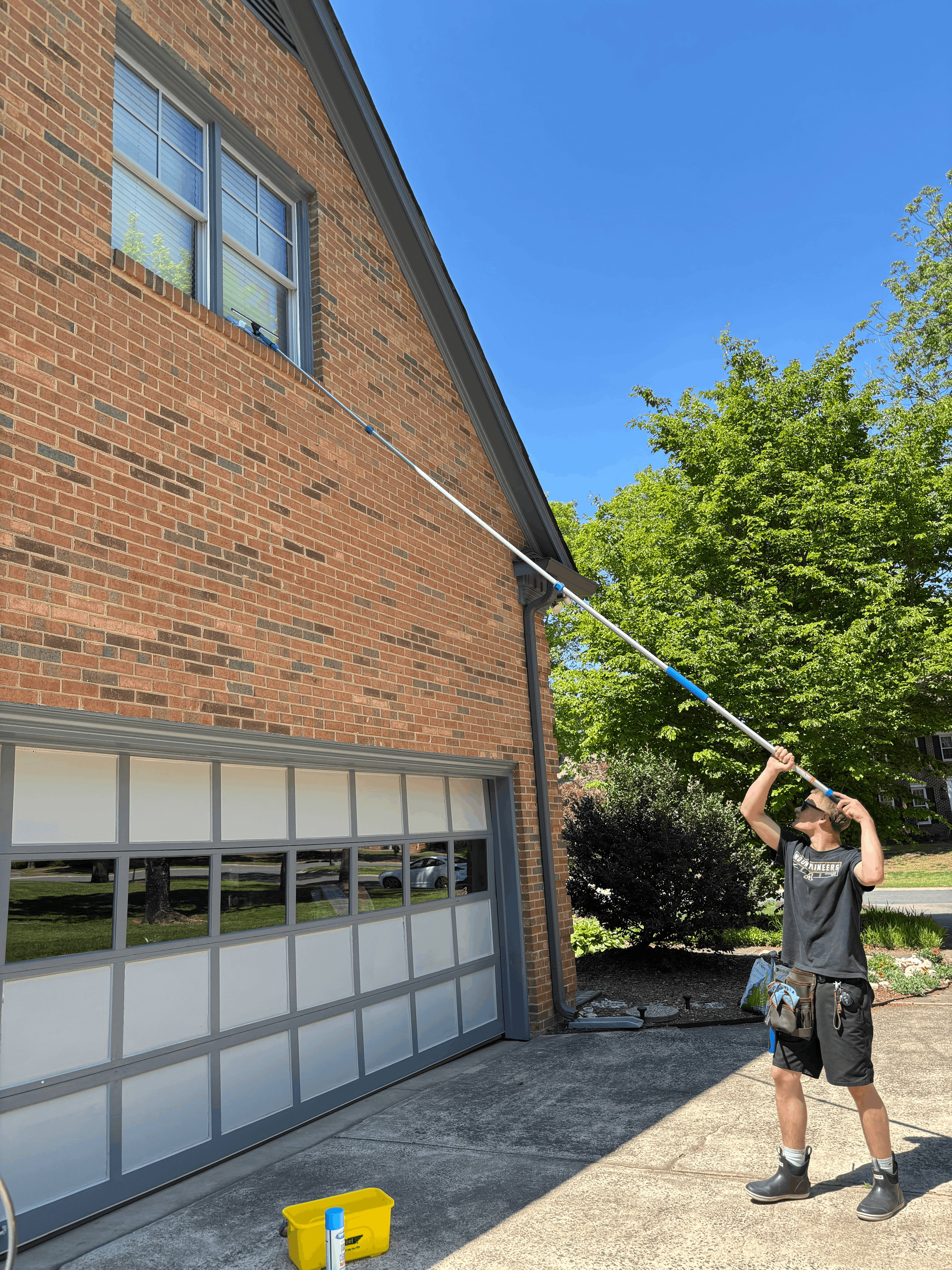 Window cleaning on a brick home